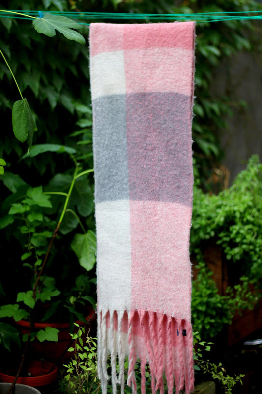 Vintage Pink and Grey Unisex Checkered Scarf Photographed on a laundry line against greenery. The fringed winter scarf is wool and viscose