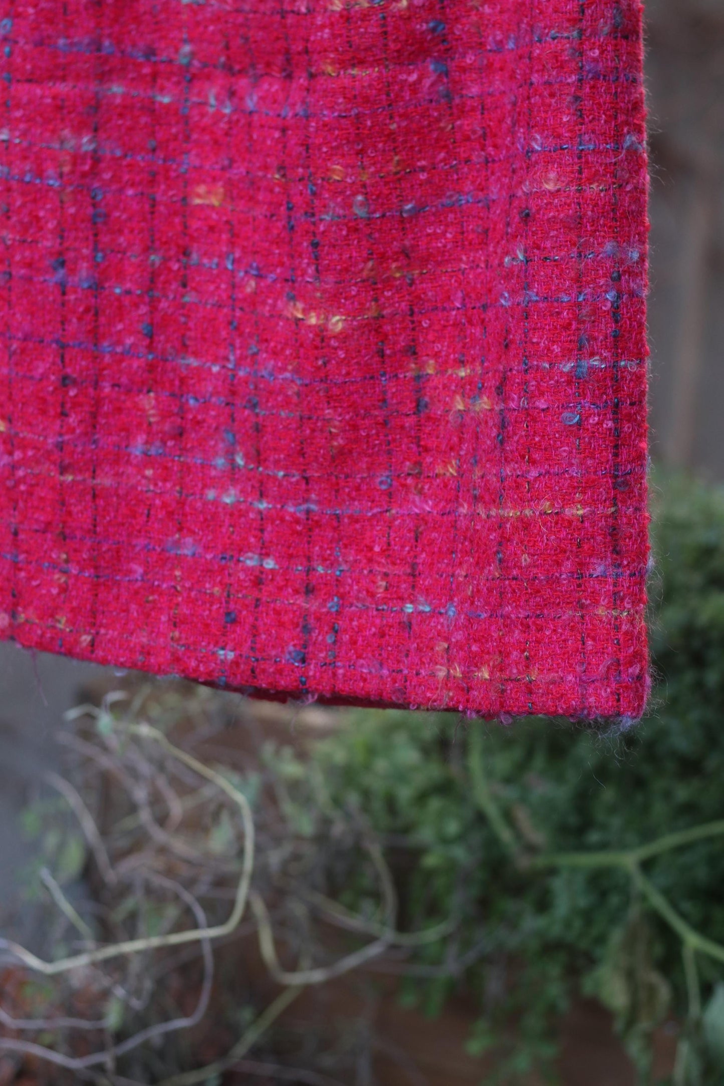 close up of the vintage pink tweed skirt showing the hints of blue in the fabric.